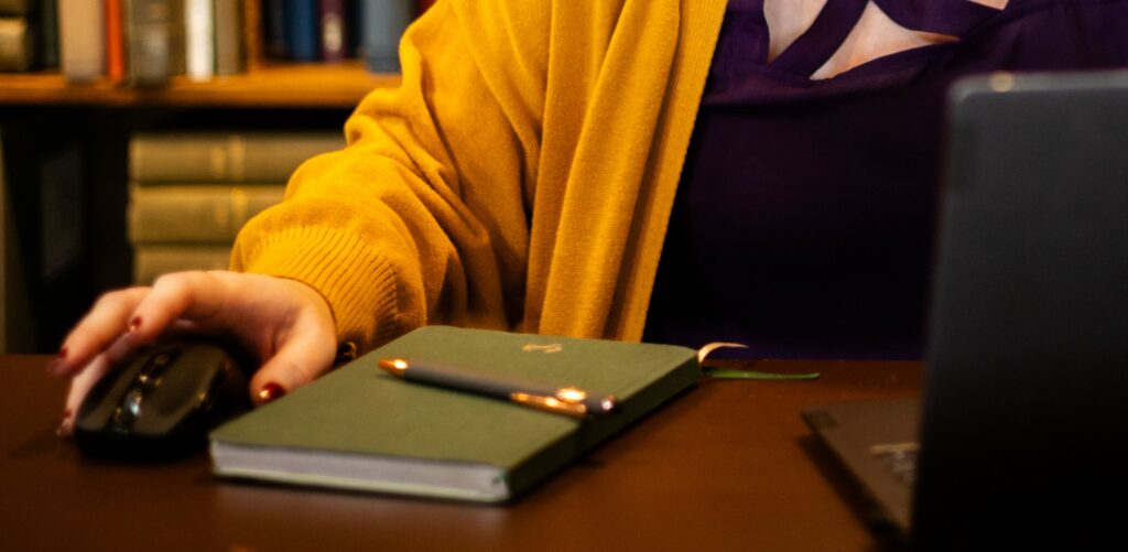 Moving from a journal to a memoir. Image shows a paper journal and pen and using a laptop.